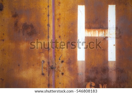 H letter on weathered rusty grunge  hidrant