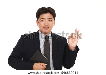 Businessman with ok hand sign	