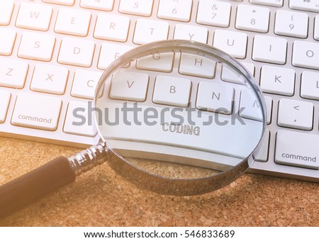 Business concept: CODING on computer keyboard background