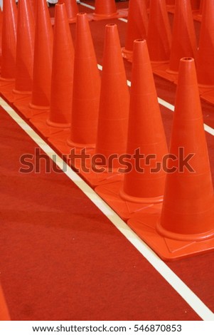 Orange cones on running track