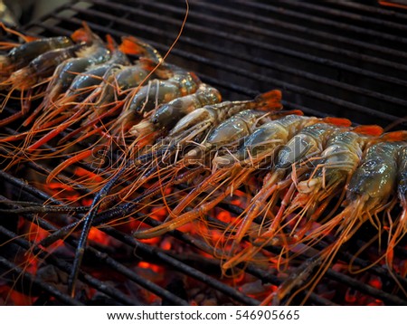 Grilled shrimps on the flaming grill, In Thailand market