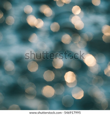 out of focus blur background with sea water in sunset light - instant vintage square photo