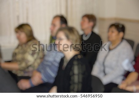 Blurred background. Audience, students