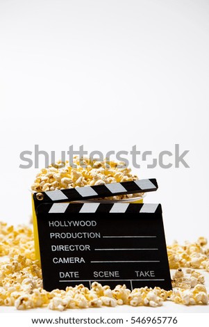 Clapper board with popcorn on copy space isolated