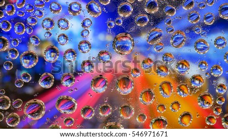 Drops of water on plastic, colorful backgrounds. (The image depth)