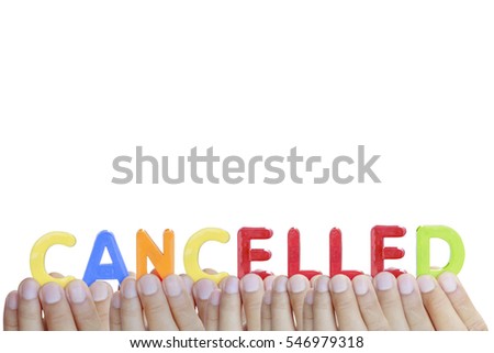 Man fingers showing "CANCELLED" text on white background