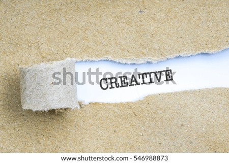 The text with conceptual behind torn brown paper