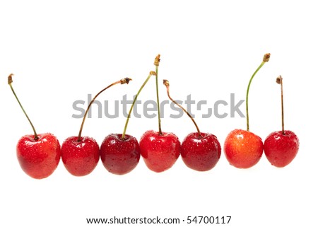 row to sweet cherrieses on white background