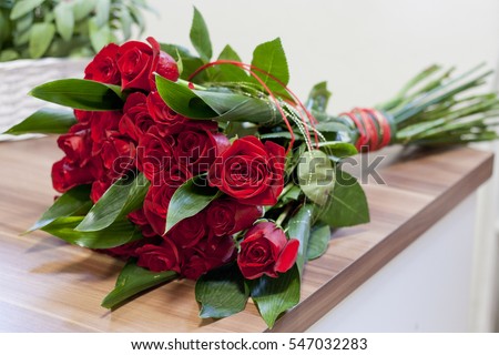 Luxury bouquet made of red roses in flower shop Valentines Bouquet of red roses Royalty-Free Stock Photo #547032283