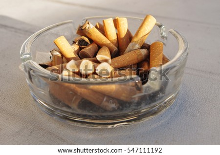 ashtray full of cigarette butts