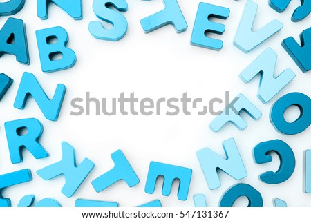 A border of colored wooden alphabet blocks