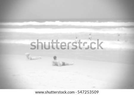 Blurred abstract background and can be illustration to article of people on white sand beach with blue sea an sky 