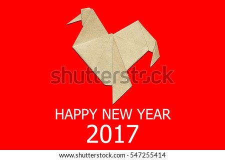Paper folded rooster handmade origami craft on red background. 2017 is year of the Rooster. Nice natural holiday greeting card, postcard. Happy new year 2017 year of rooster text letters.