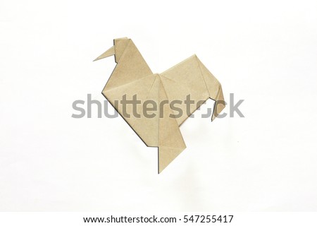Paper folded rooster handmade origami craft on white background. 2017 is year of the Rooster.
