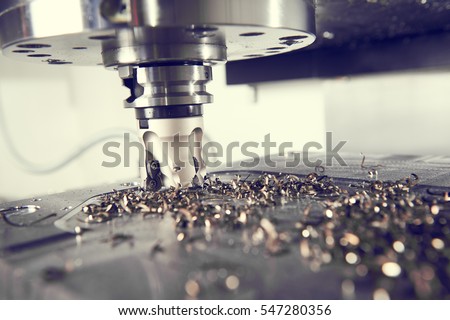 industrial metalworking cutting process by milling cutter Royalty-Free Stock Photo #547280356