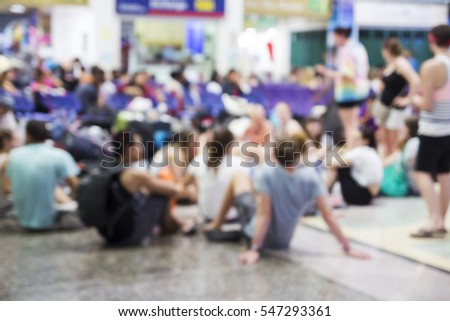 Blurred background of travelers waiting train in station