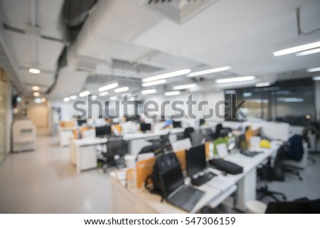 office blur background with worker and computer Royalty-Free Stock Photo #547306159