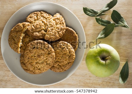 Oatmeal cookies with apple and bay leaf top view. Flat lay Royalty-Free Stock Photo #547378942