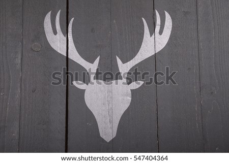 Illustration of reindeer on wooden background