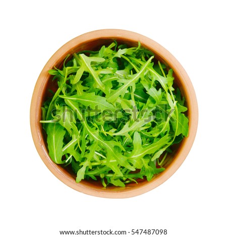 Fresh rucola isolated. Ceramic bowl full of rocket salad leaves isolated over the white background, top view above Royalty-Free Stock Photo #547487098