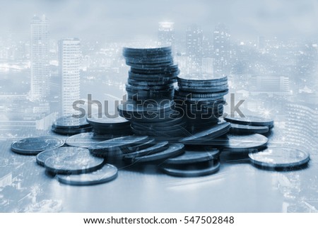 Double exposure of city coin, blue tone, for finance and business concept