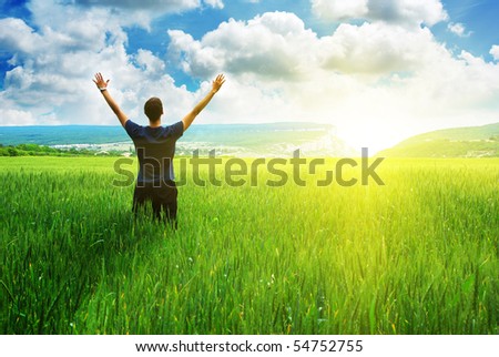 Man in meadow green meadow. Emotional scene. Royalty-Free Stock Photo #54752755