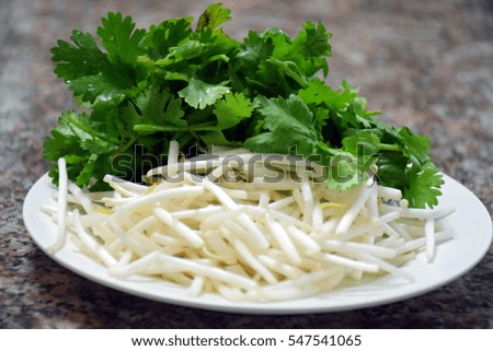 Bean sprouts and coriander served with for Shark fin soup. 