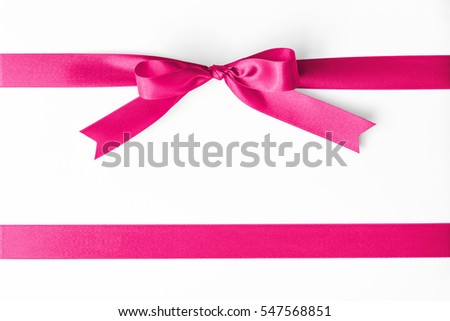 Satin sweet pink color ribbon band stripe fabric bow isolated on white background with clipping path