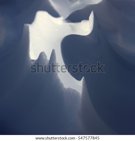 Background of snowdrift with blue shadows. Siberia, Russia.