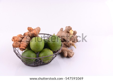 Tumeric, Ginger and Lime in isolated white with selective focus