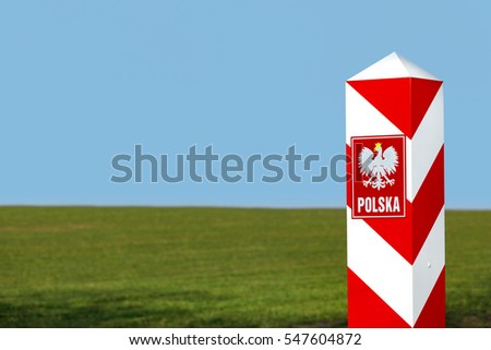 Border post with the emblem of the Polish. 