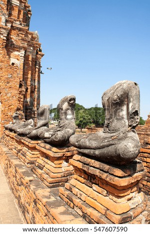 Broken Buddha Statue Sitting on The Old Brick