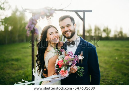Happy bride and groom after wedding ceremony  Royalty-Free Stock Photo #547631689