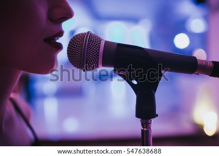 singer and microphone Royalty-Free Stock Photo #547638688