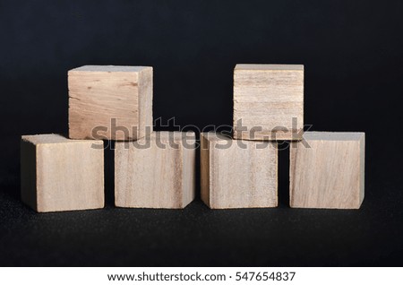 A wooden cubes with black background
