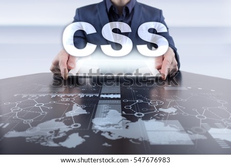 Businessman using tablet pc and selecting css.