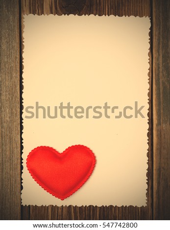 photo paper background with hearts. empty blank with red heart on wooden surface. Valentines day. instagram image filter retro style