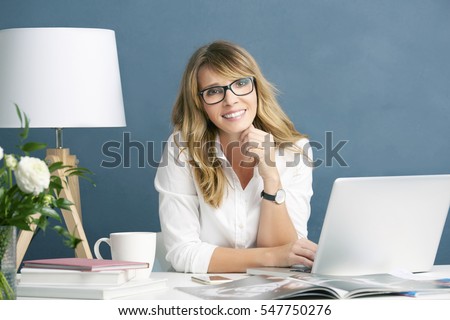 Shot of a fashion magazine editor in chief woman using her laptop while working on new editorial in her office.