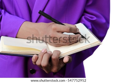 Businessman with notepad in hands signing documents on white background