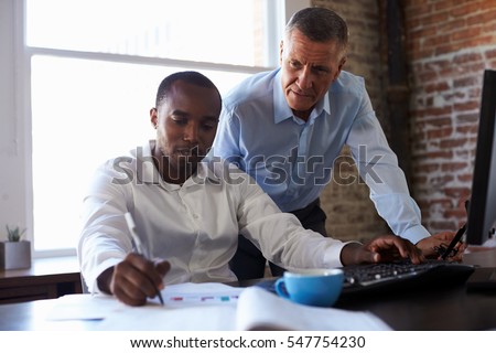 Businessmen Working On Computer In Office Royalty-Free Stock Photo #547754230