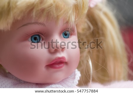 Close up of a beautiful doll with blue eyes