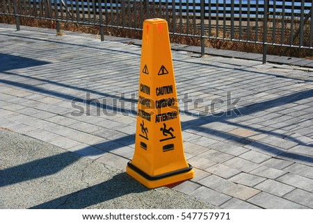 Falling caution sign.
