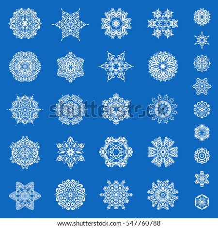 Abstract minimal set of twenty nine vector snowflakes on a blue background.
