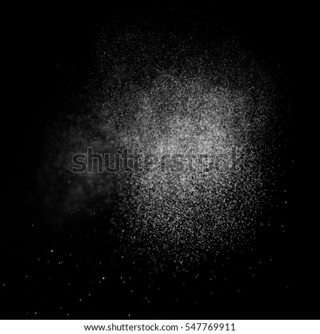Abstract splashes of water on a square black background. Freeze motion of white particles. Rain, snow overlay texture. 
