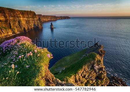 Ireland countryside tourist attraction in County Clare. The Cliffs of Moher and castle Ireland. Epic Irish Landscape Seascape along the wild atlantic way. Beautiful scenic nature hdr Ireland. Royalty-Free Stock Photo #547782946