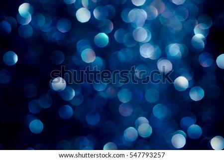 blue and purple bokeh glitter vintage lights background defocused
