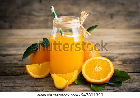 Fresh orange juice in the glass jar Royalty-Free Stock Photo #547801399