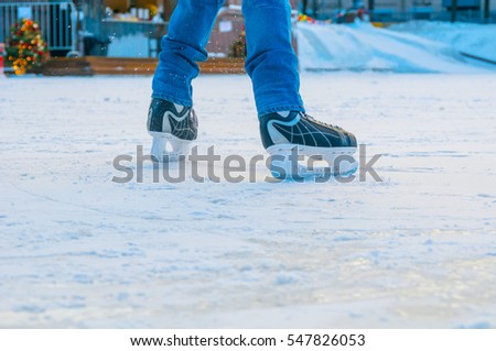 Skater in motion at skating rink