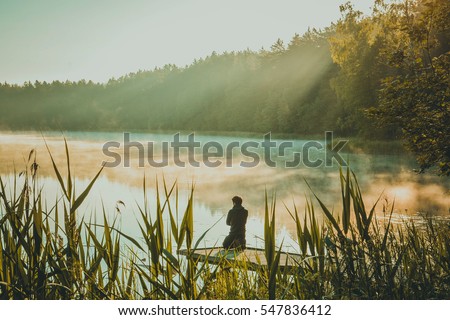 Man meditating by the lake