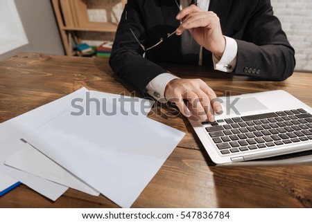 Office worker scrolling down the page